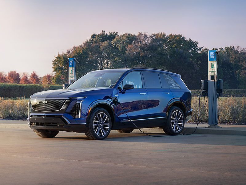 Three-quarter View of a Cadillac VISTIQ Charging at a Public GM Energy Charger