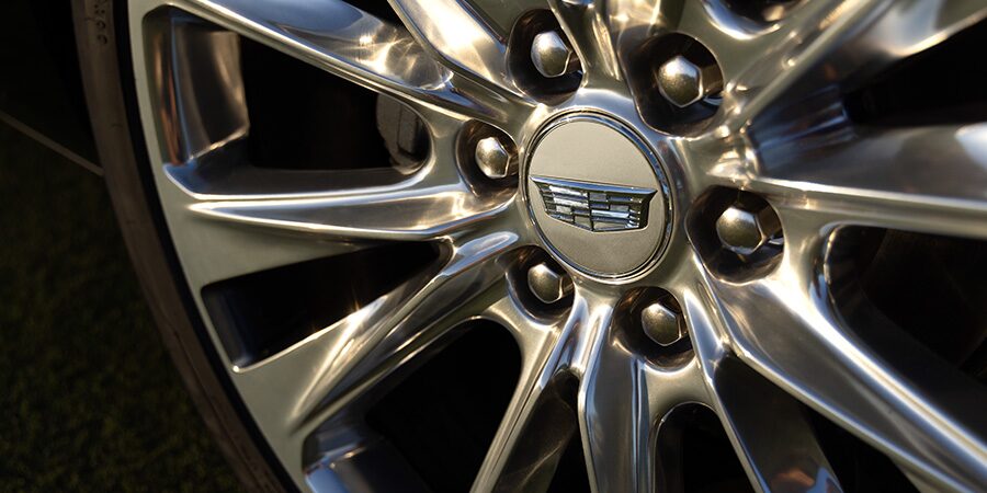 Close-up of a Cadillac Tire with the Steel Emblem at the Center of the Wheel