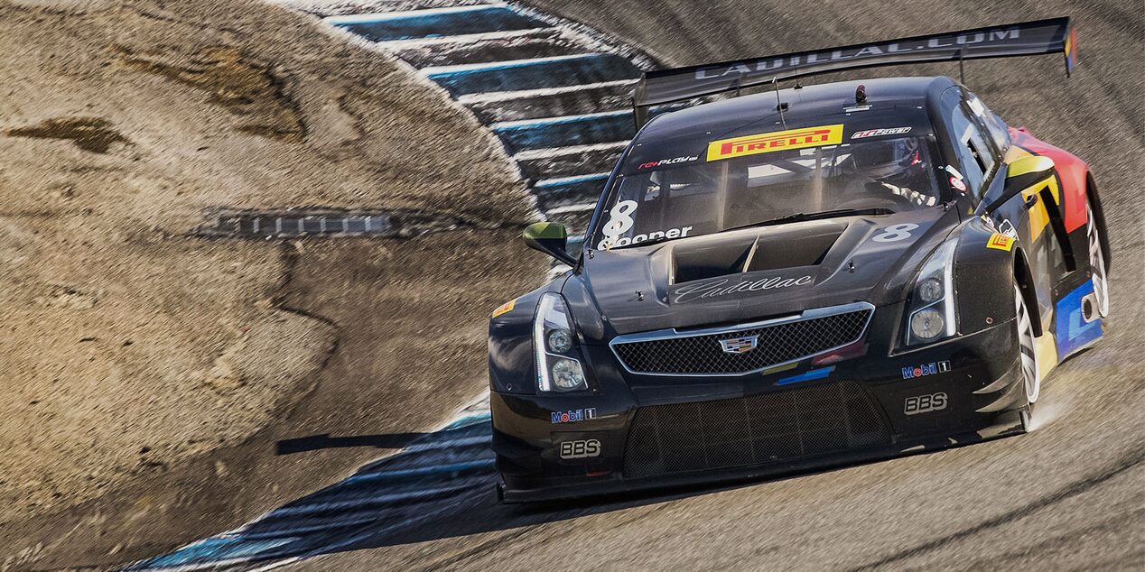 The Cadillac Racing ATS-V.R Heritage Racecar Fiercely Driving on a Track