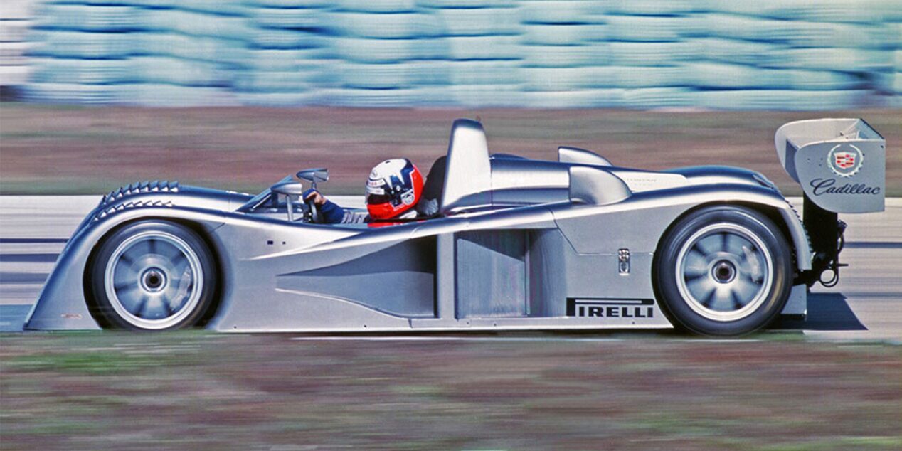 Side View of the Cadillac Northstar LMP Racecar Driving on a Track