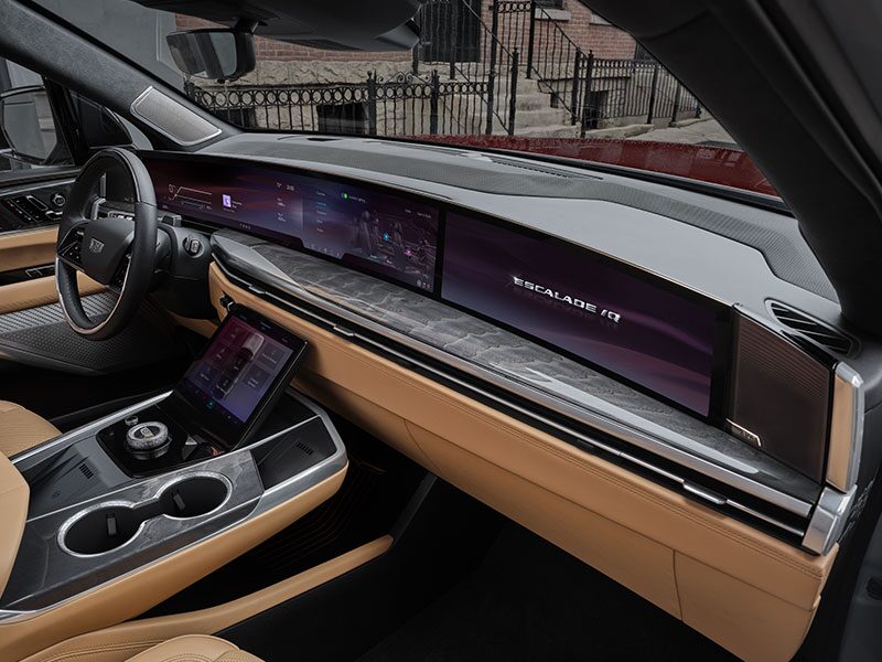 Passenger Side View of the ESCALADE IQ 55" Diagonal Display Screen and Front Row Interior