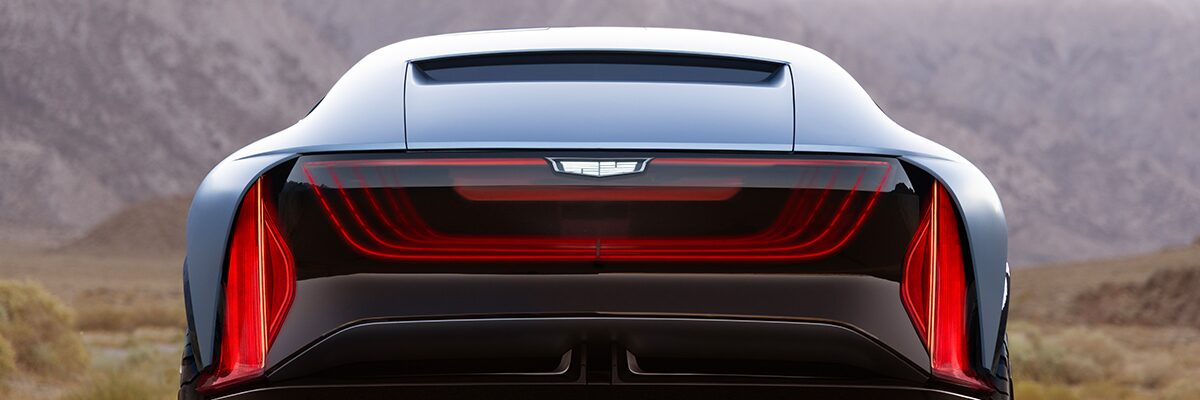 Rear View of the Cadillac Elevated Velocity Concept Vehicle Trunk and Tail Lights On in the Desert