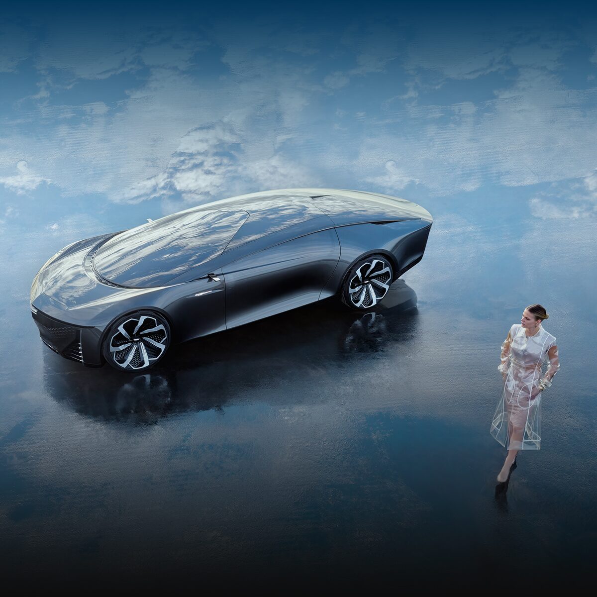 Top View of a Woman Walking near the Cadillac Innerspace Concept Vehicle Parked on a Reflective Ground