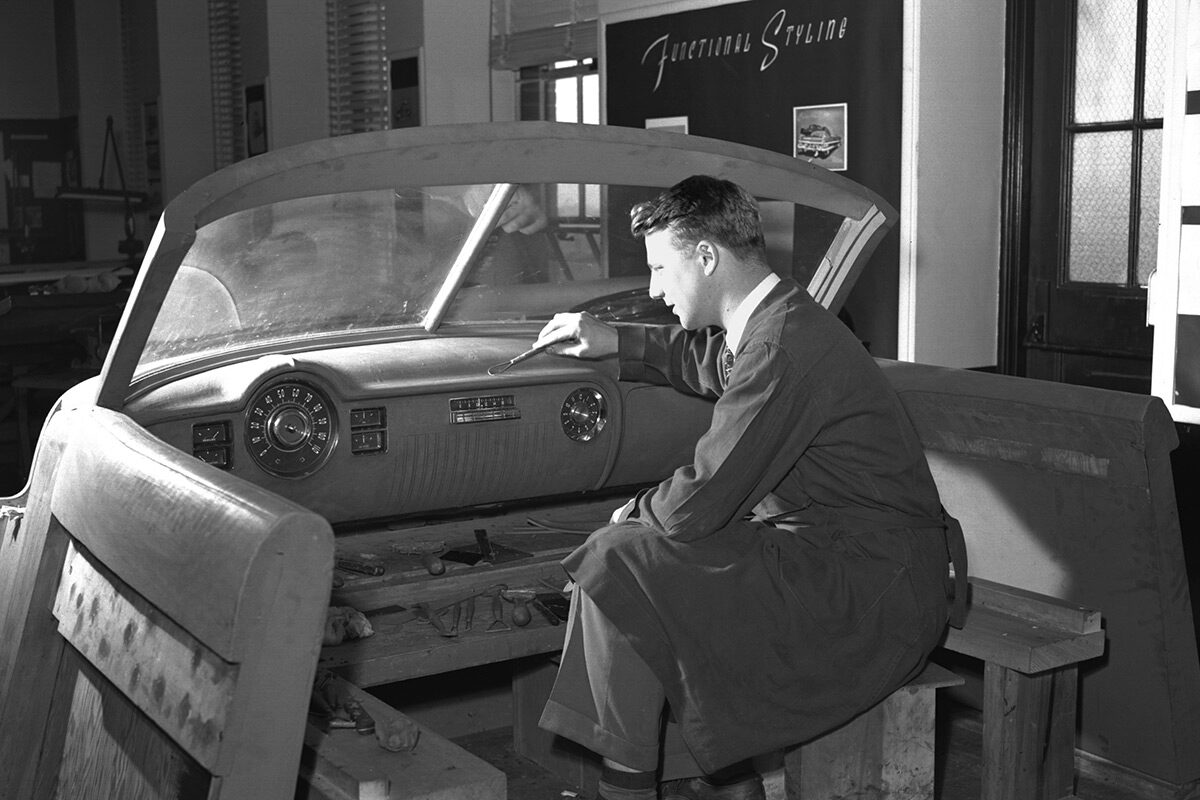 Sculptor at work on a 1950 Cadillac interior clay model, 5/18/1948