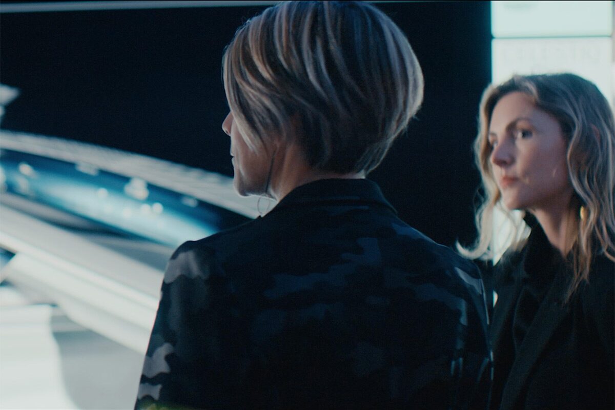 Two Women Staring At Monitor