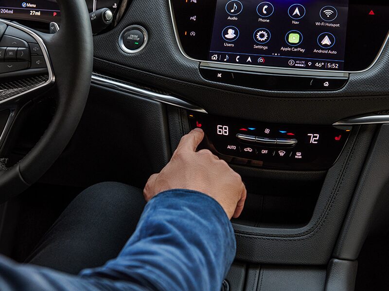 A Man Adjusts the Air Temperature Using the Cadillac's XT5 Driver Climate Control