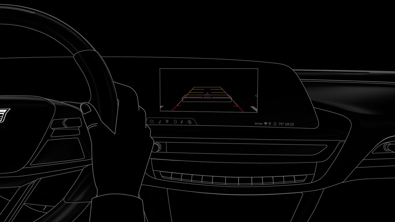 A Person Using the Rear View Mirror Camera Safety Feature in the 2025 Cadillac XT5