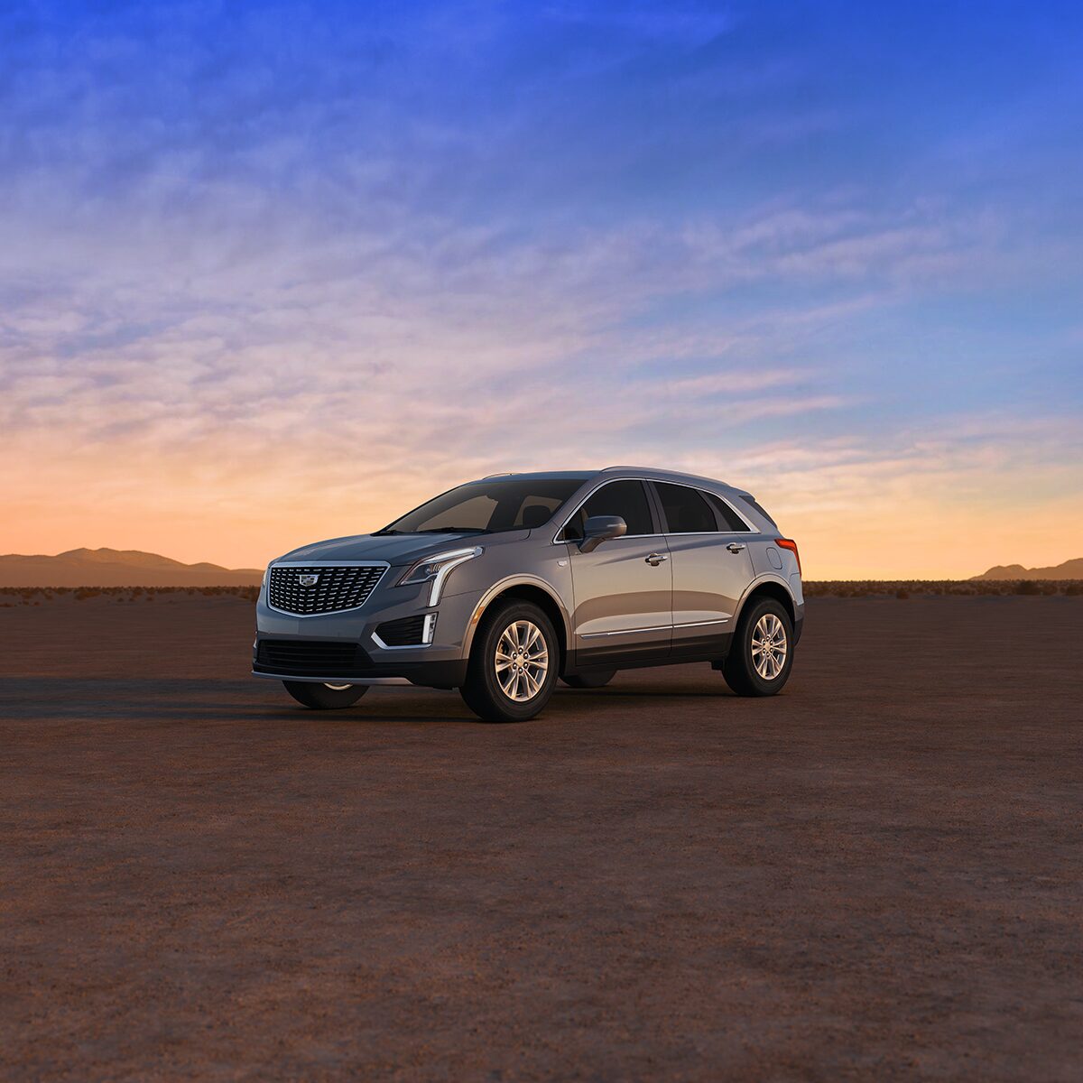 The Crystal White Tricoat Cadillac XT5 Parked During a Lovely Sunset