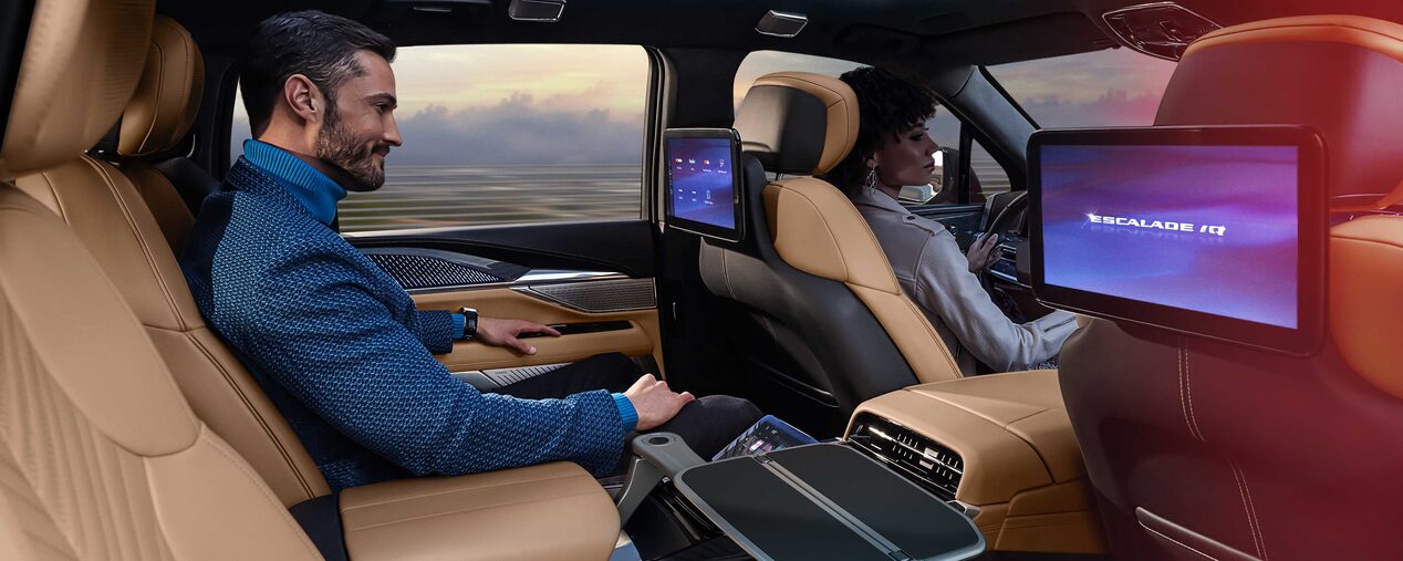 Man Smiling While Riding in the 2025 Cadillac ESCALADE IQ Executive Second Row