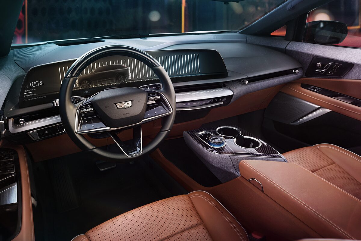 Driver's View of the 2025 OPTIQ Front Interior Cabin with Reddish Brown Leather Seating