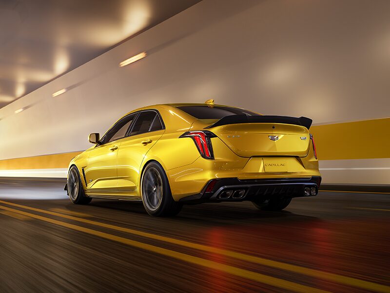 Rear View of a Yellow 2025 CT4-V Driving Through a Tunnel