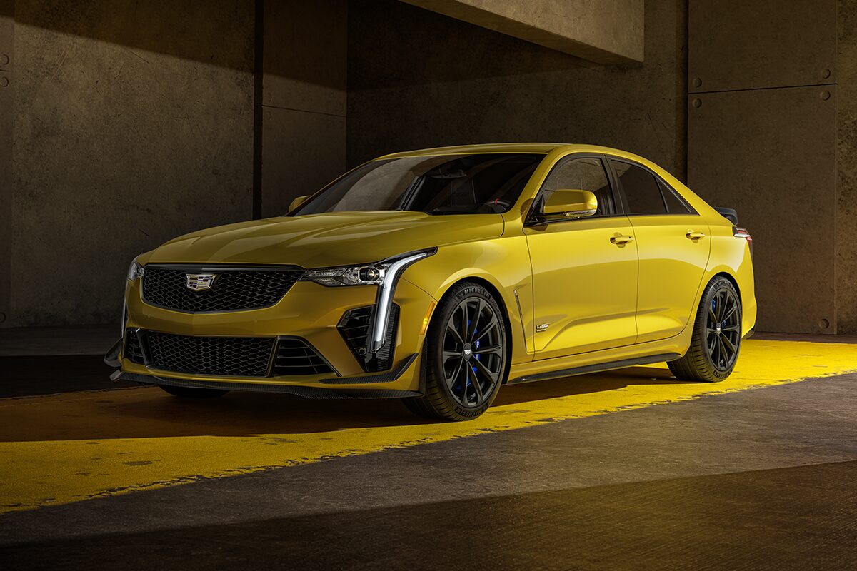 Three Quarters View of a Yellow 2025 Cadillac CT4-V Parked in Parking Garage