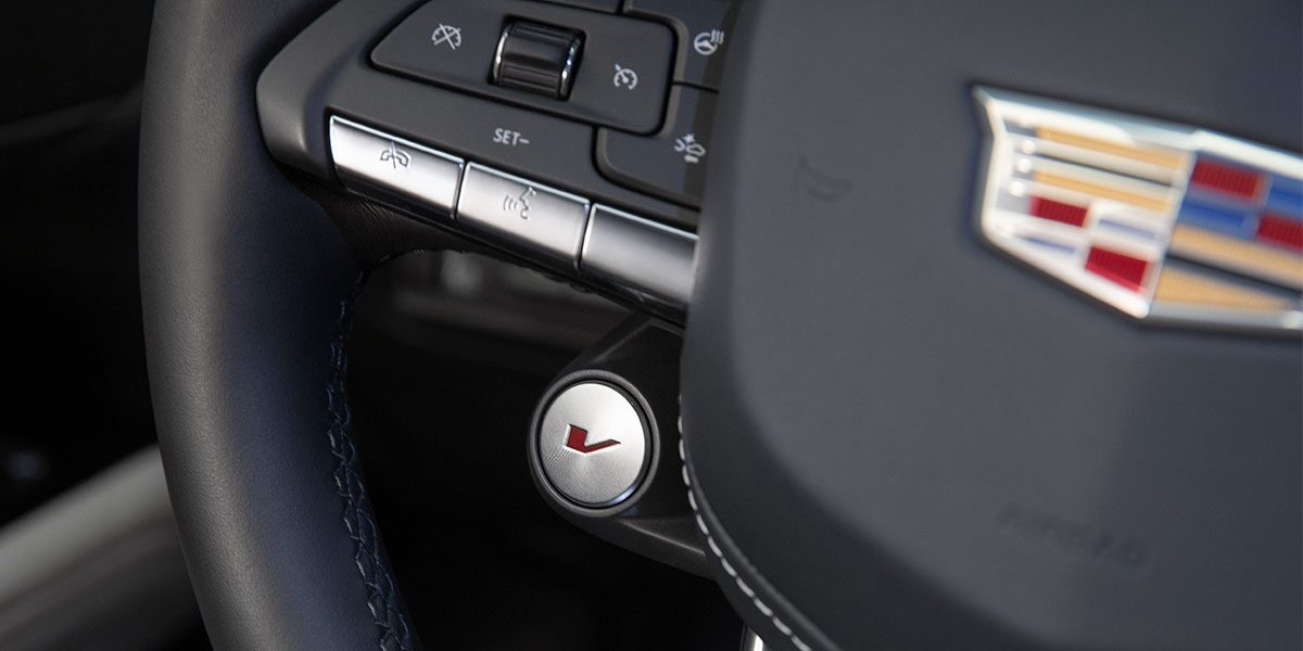 Close-up of the V Button on the 2025 CT4-V Steering Wheel