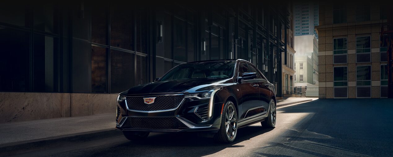 Three Quarters Front View of a Black 2026 CT4 Parked Downtown