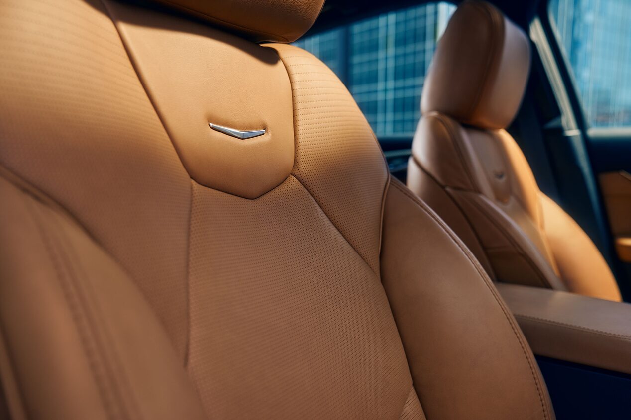 Sun Shining on the 2025 Cadillac CT5 Crest on Front Leather Seats