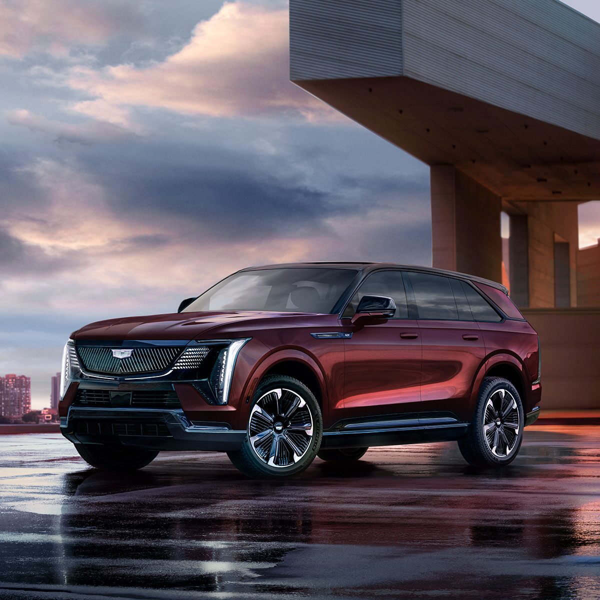 Three-quarter Driver Side View of a Maroon 2026 ESCALADE IQ EV SUV Parked