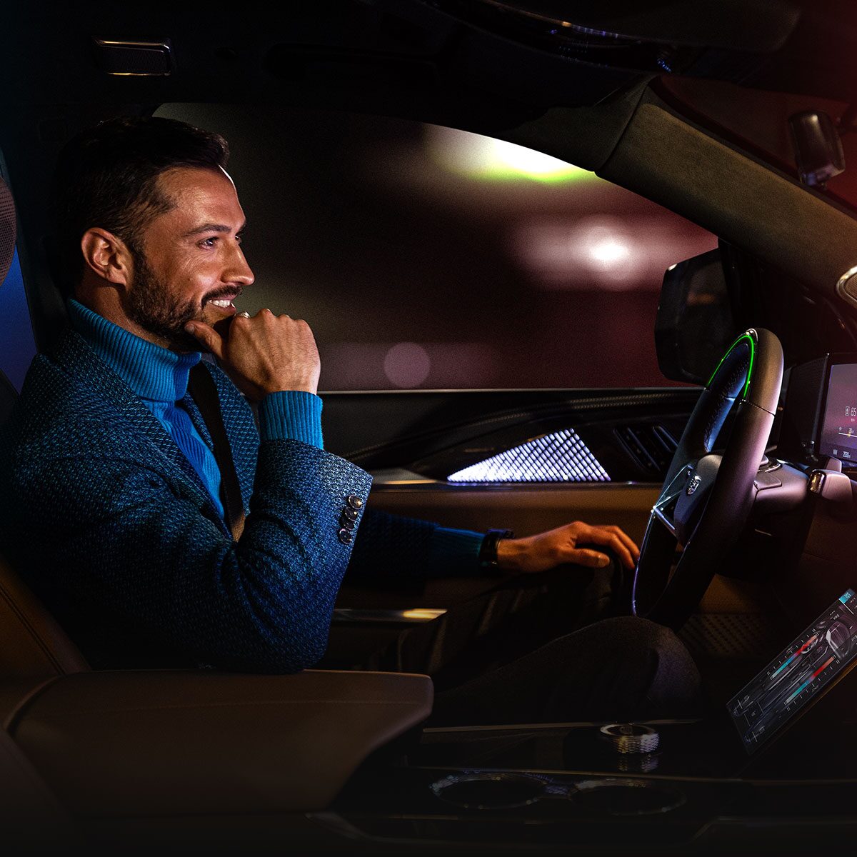 Passenger View of a Man Driving the 2026 ESCALADE IQL Large Electric SUV in the Desert