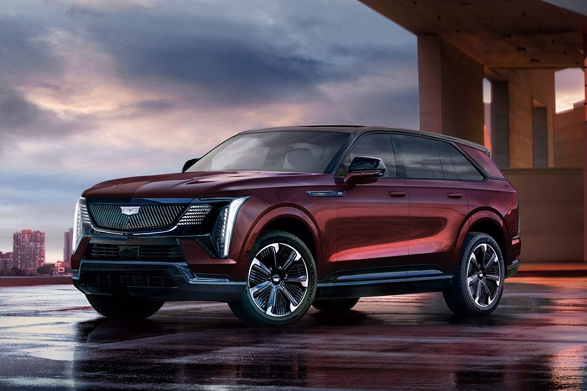 Three-quarter Driver Side View of a Maroon 2026 ESCALADE IQ EV SUV Parked
