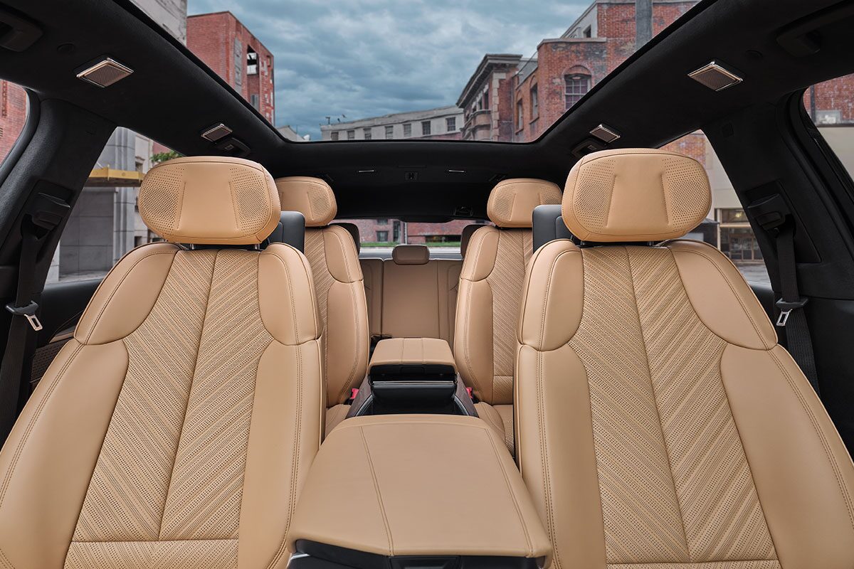 Front Seat View of the Three-Row Tan Seating in the 2026 ESCALADE IQ