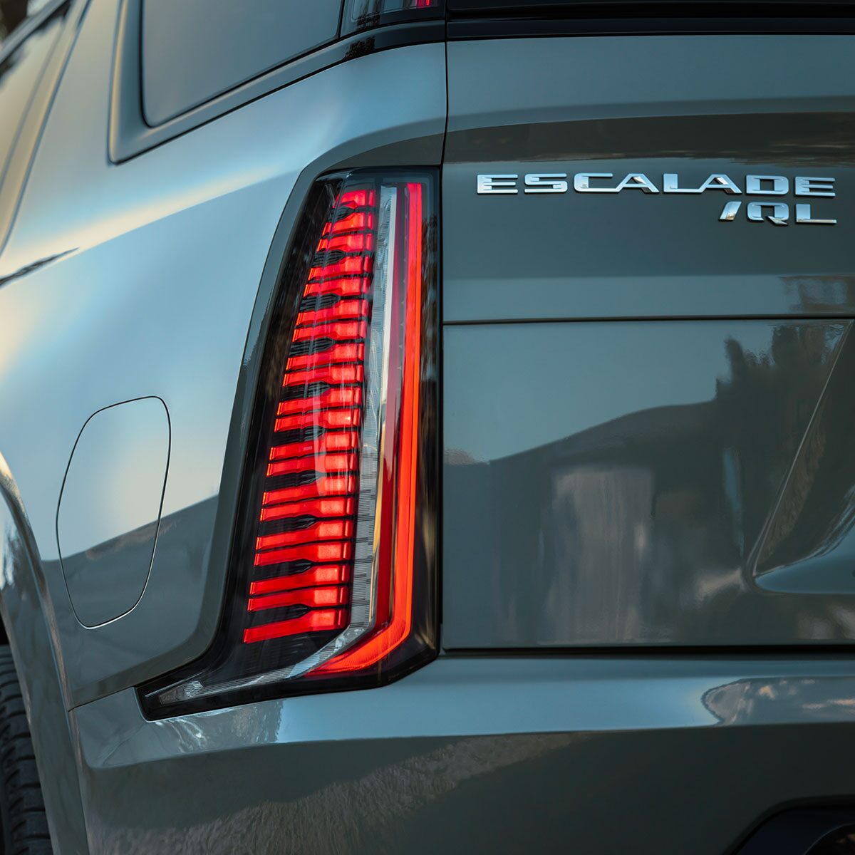 Close-up of the 2026 ESCALADE IQL Exterior Rear Lights and Nameplate Badge