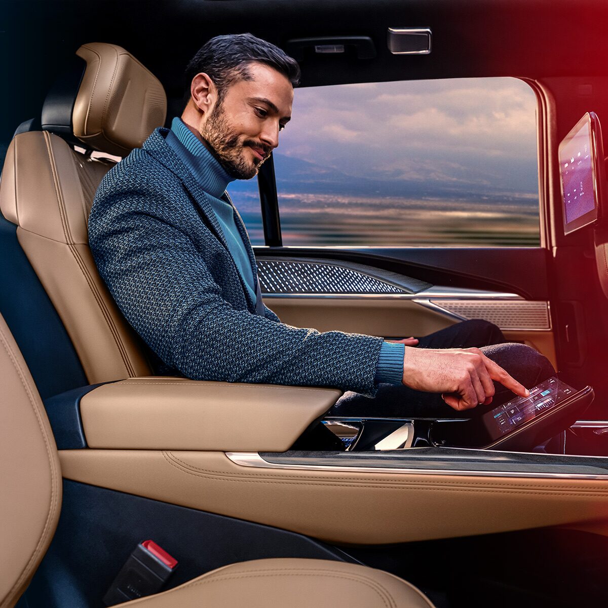 A Man Choosing an Option on the Center Console Control Center in the 2026 ESCALADE IQL
