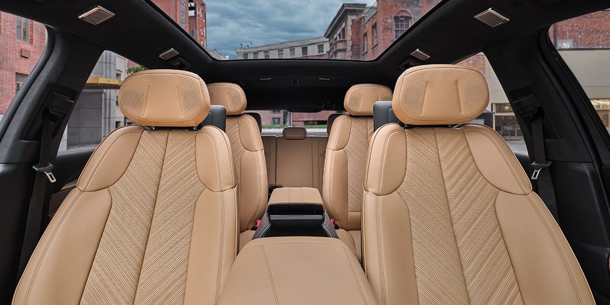 Front Seat View of the Three-Row Tan Seating in the 2026 ESCALADE IQ