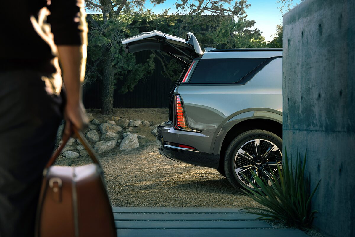 Rear Profile View of the 2026 ESCALADE IQL Parked with the Trunk Door Open