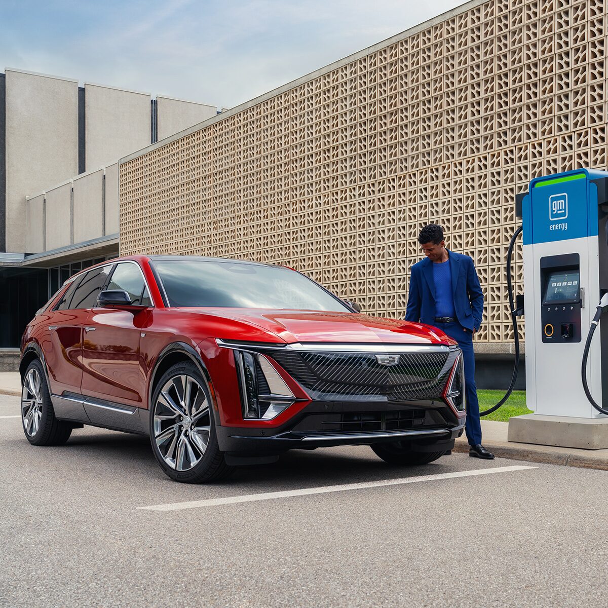 A Man Charging the 2026 LYRIQ-V at a GM Energy Charging Station