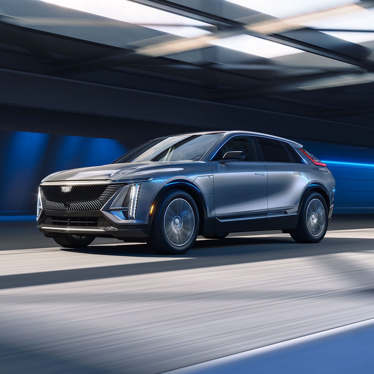 Three-quarter View of the Luxurious Cadillac LYRIQ Driving Through a Lit Up Tunnel
