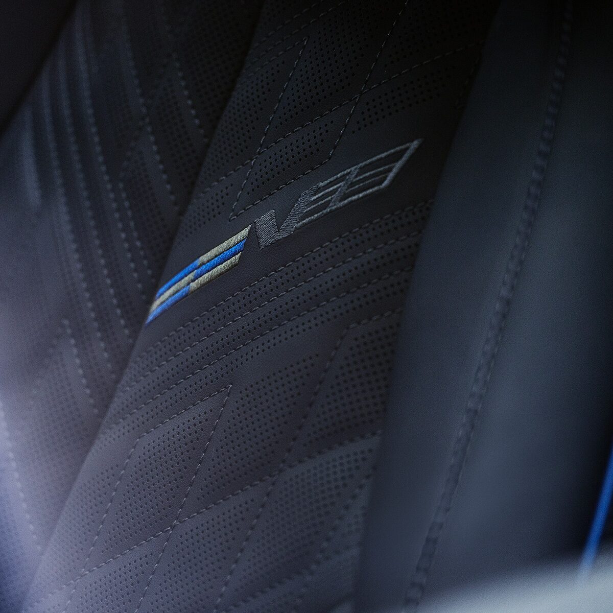 Close-up of the V-Series Signature on the 2026 OPTIQ-V Seat
