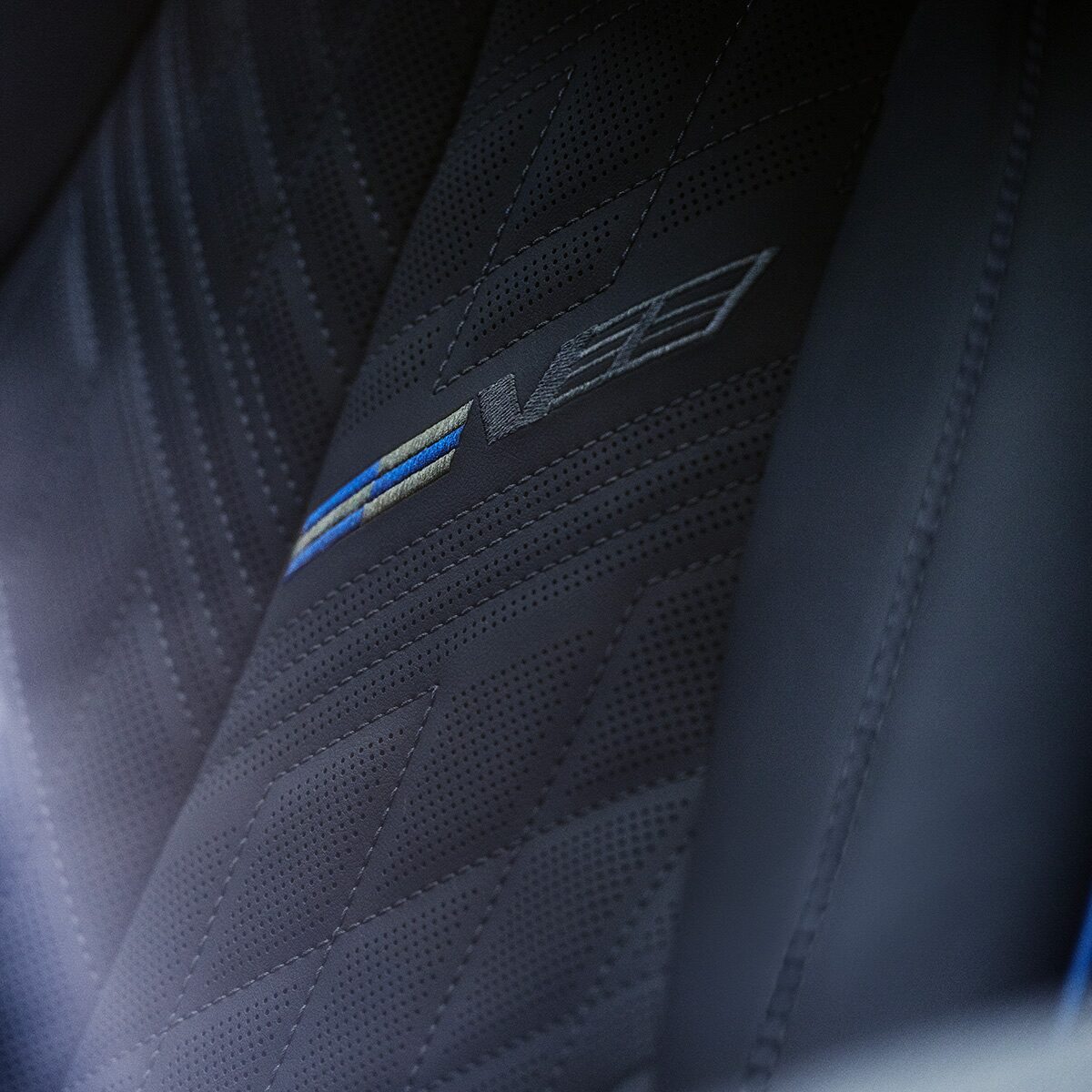 Close-up of the V-Series Signature on the 2026 OPTIQ-V Seat