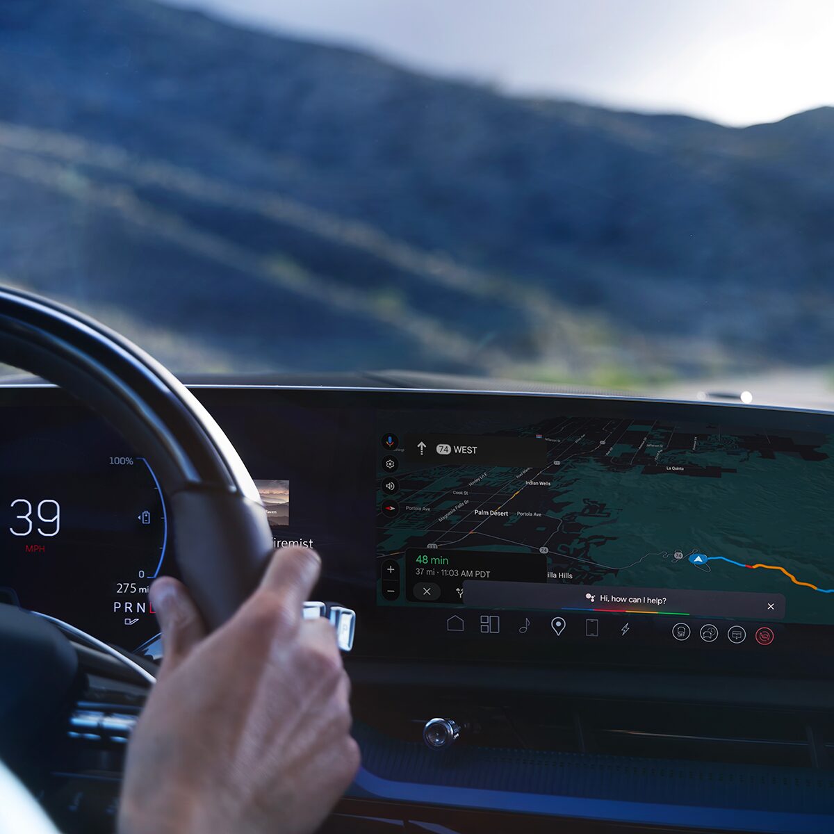 Close-up of Someone Driving the 2026 OPTIQ-V and Utilizing the Navigation on the Display Screen