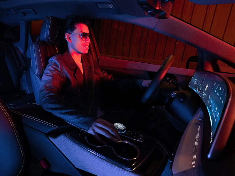 Passenger View of a Driver in the 2026 Cadillac OPTIQ in Red Light
