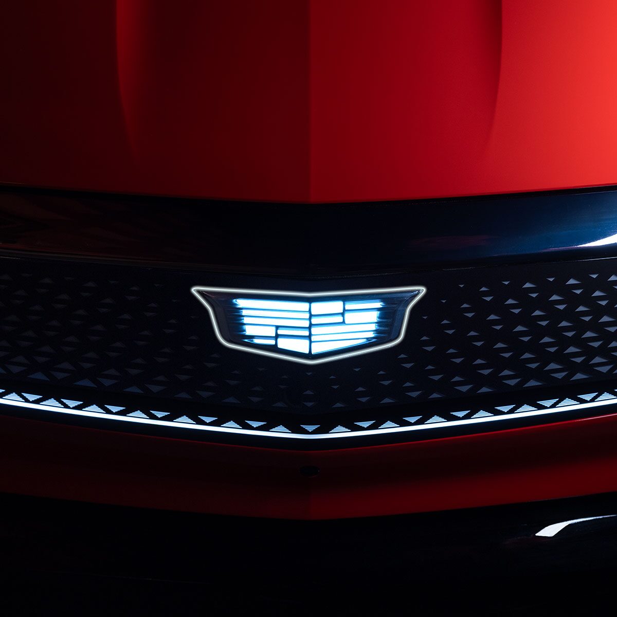 Front View of the Cadillac Logo Illuminated on the Grille