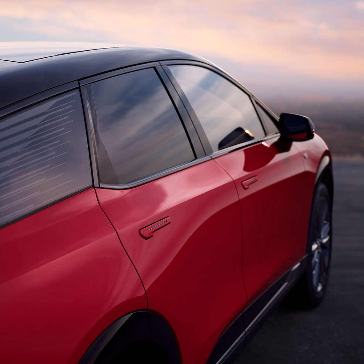 A Rear View of the Right Side of a Red Cadillac OPTIQ