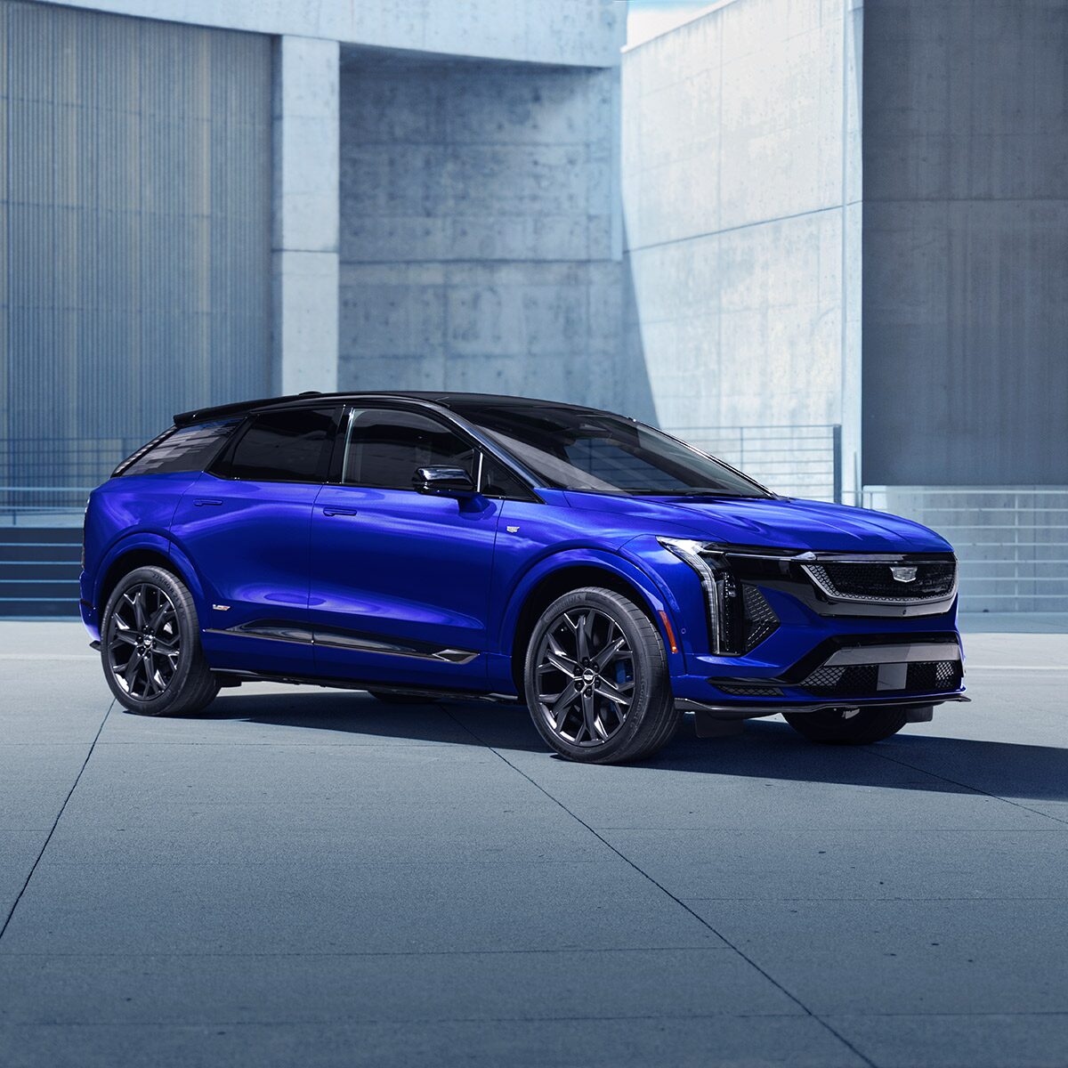 Three-quarters Passenger Side View of a Parked Blue 2026 OPTIQ-V