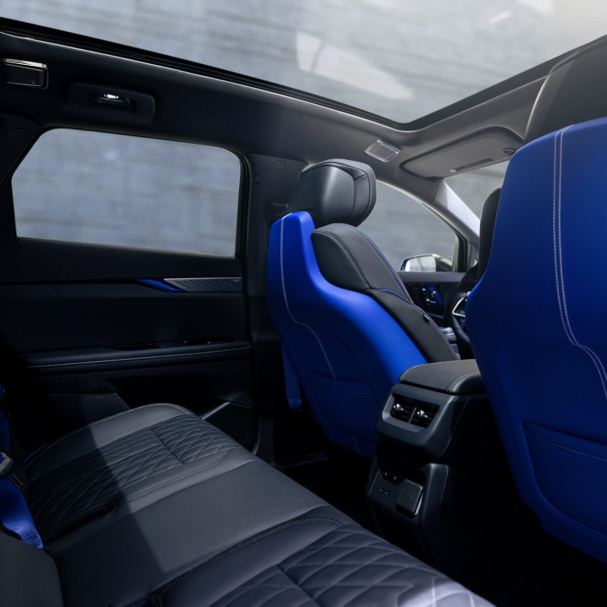 Back Seat View of the 2026 OPTIQ-V Blue Front Seats, Sun Roof, and Interior