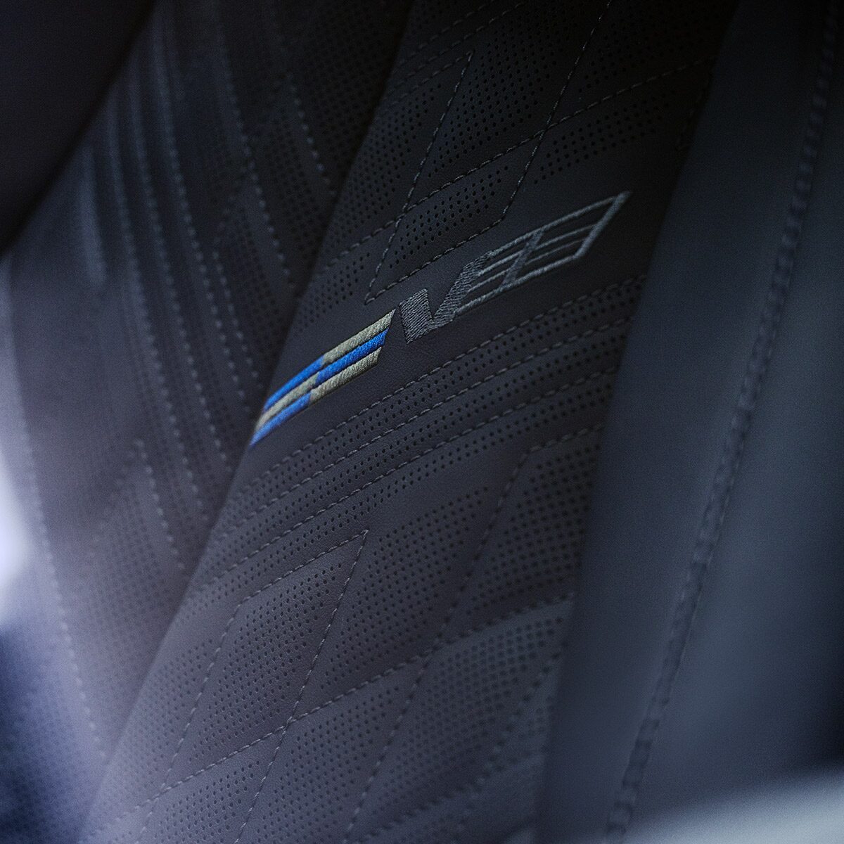 Close-up of the V-Series Signature on the 2026 OPTIQ-V Seat