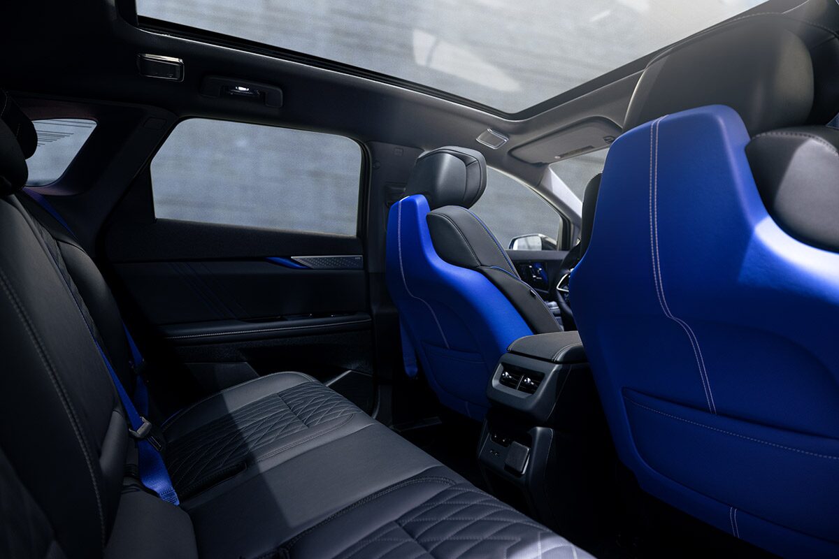Back Seat View of the 2026 OPTIQ-V Blue Front Seats, Sun Roof, and Interior