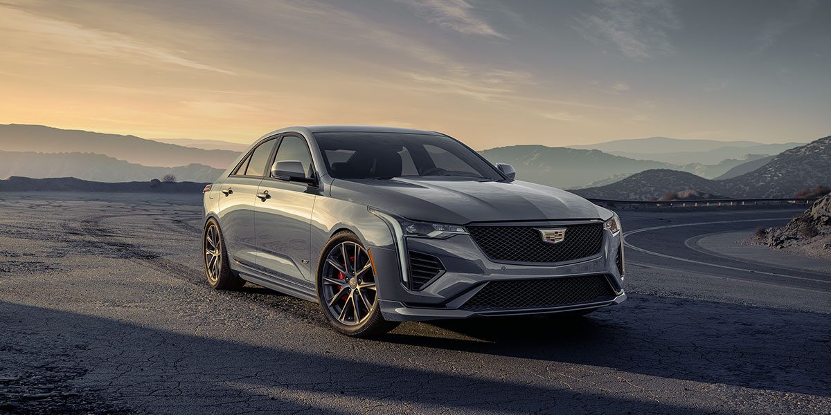 Three-quarters View of a Silver CT4-V Sport Sedan Parked on the Side of a Mountain Road