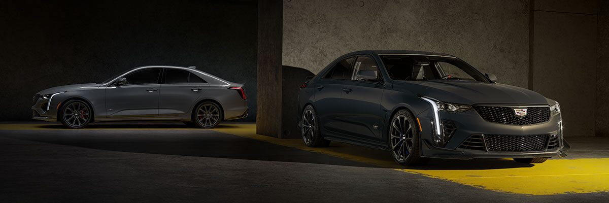 A Silver CT4-V and a Yellow CT4-V Blackwing Parked in a Parking Garage