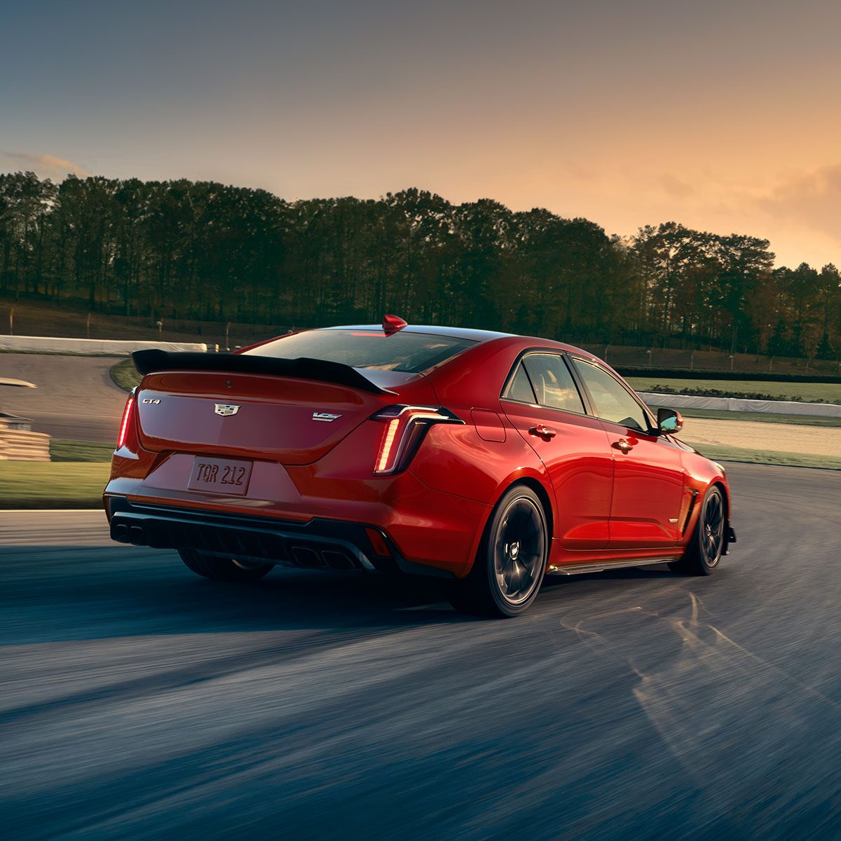 Rear View of a Red CT4-V Speeding Down a Racetrack