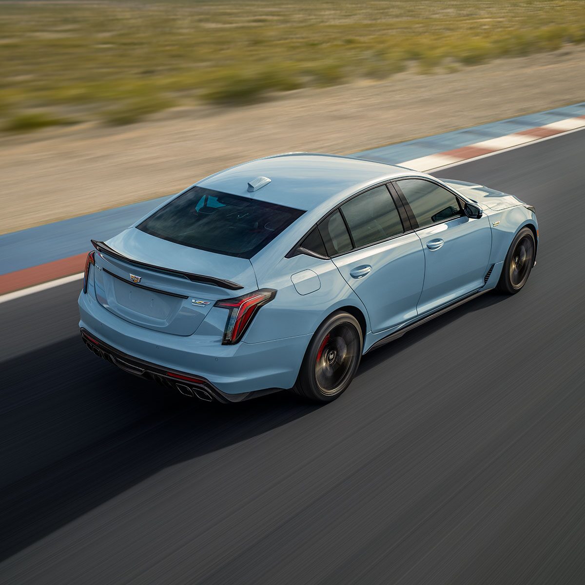 Overhead Rear View of a Cadillac CT5-V Driving Down a Race Track
