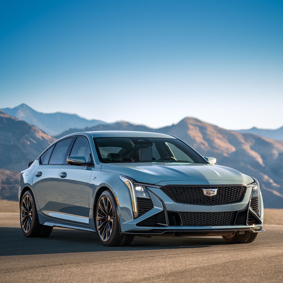 Three-quarters Passenger View of a Cadillac CT5-V Parked in Front of the Mountains