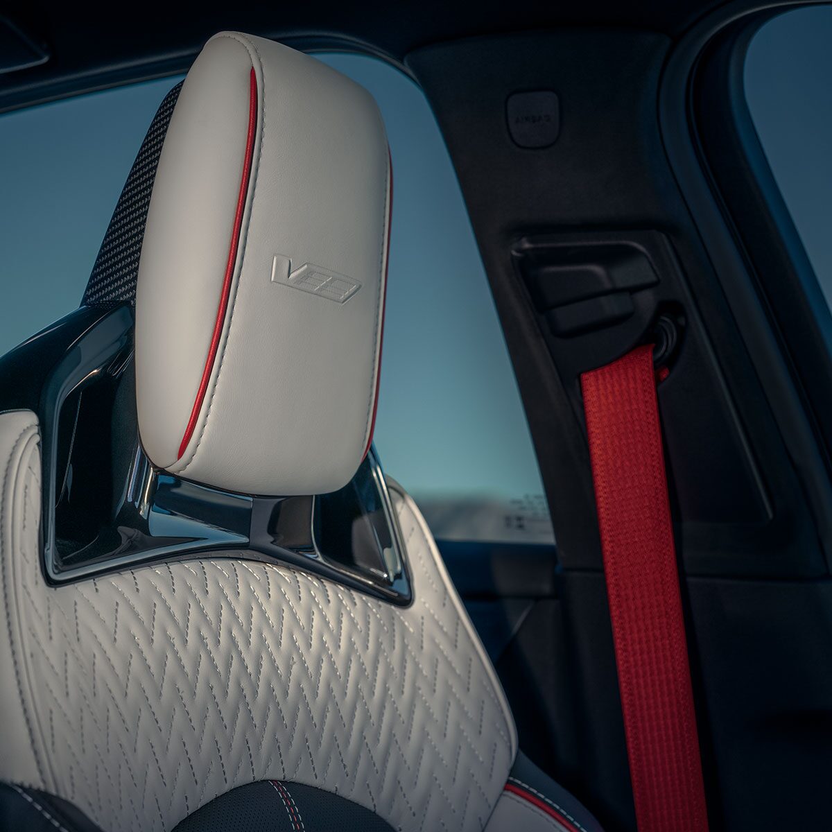 Close-up of the Race-inspired CT5-V White Seat and Red Seatbelt