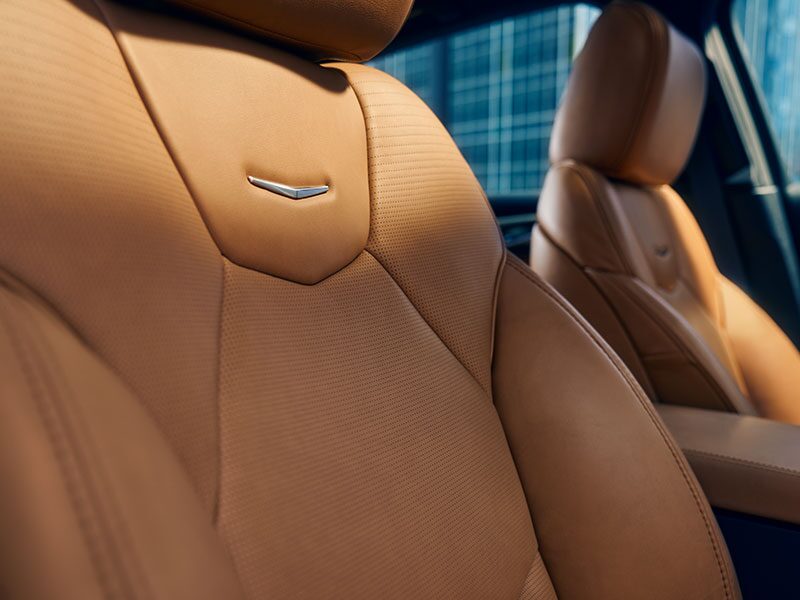 Sun Shining on 2026 Cadillac CT5 Crest on Front Leather Seats