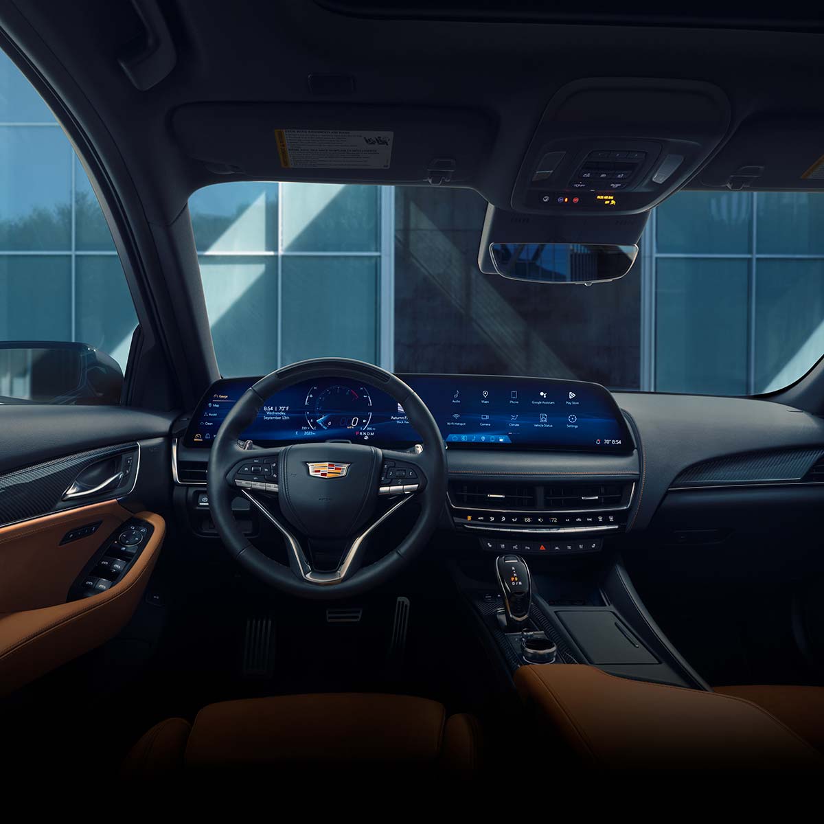 Driver's Side of 2026 Cadillac CT5 Tan and Jet Black Accent Interior Outlooking Industrial Buildingfpo