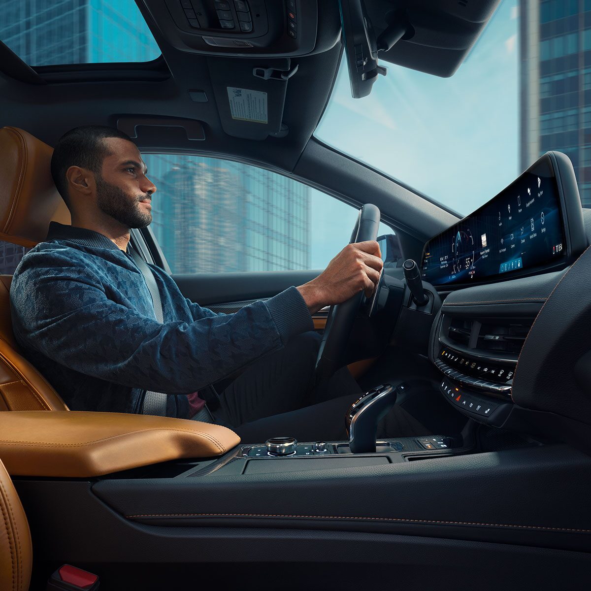 Passenger View of Man Driving a 2026 Cadillac CT5 Through the City