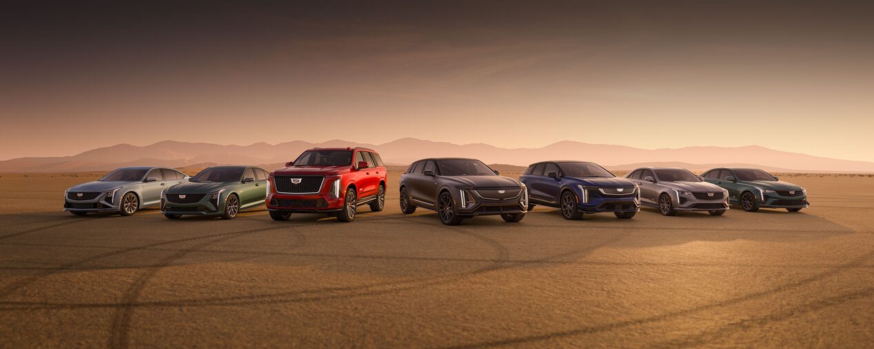 Cadillac's V-Series Performance Lineup on a Desert Field with Mountains in the Background