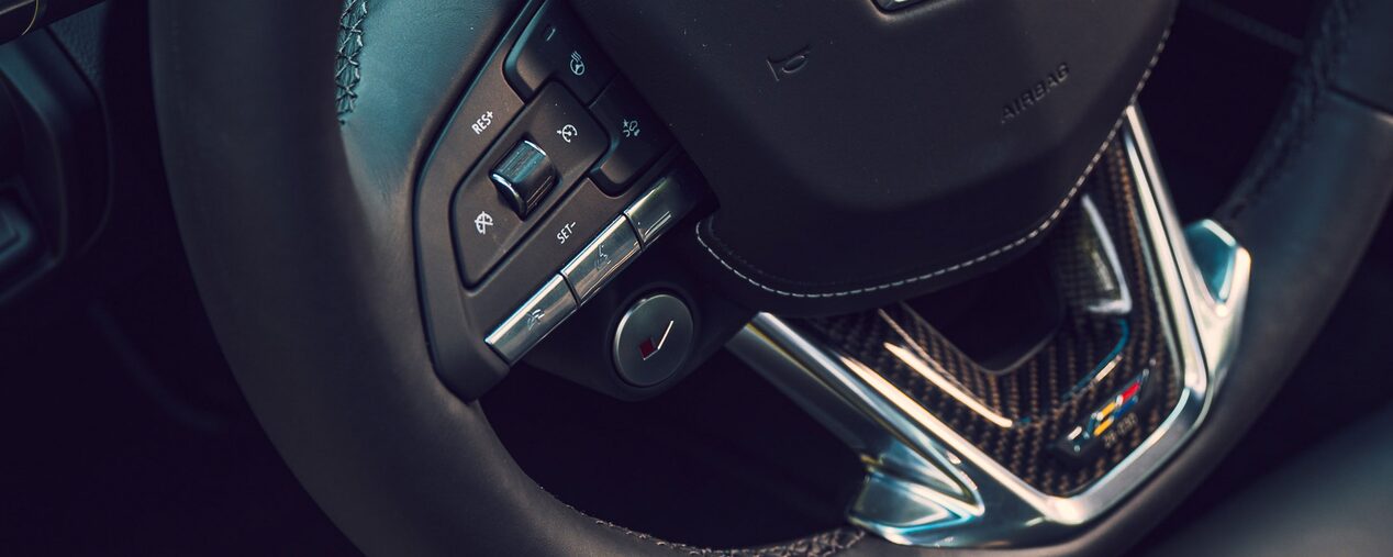 Close-up View of a Cadillac Performance V-Series Vehicle Steering Wheel.